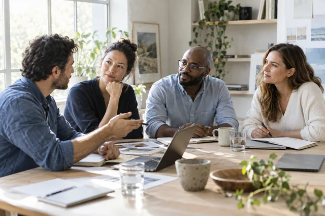 People sharing a conversation around a table