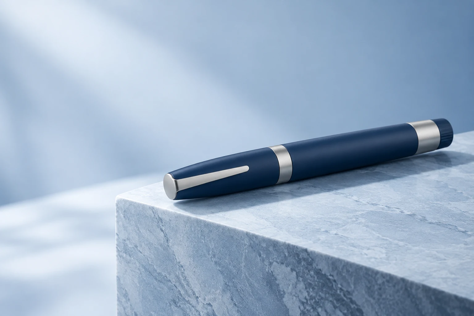 Illustrative unbranded, capped injection pen on a pale blue surface